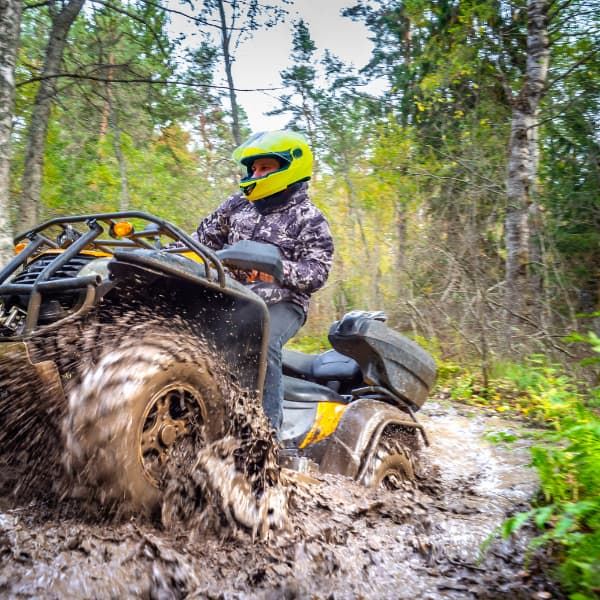 Rider mudding in ATV