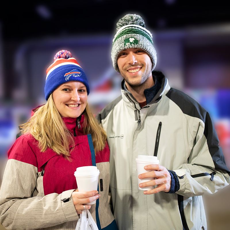 Man and woman drinking a beverage