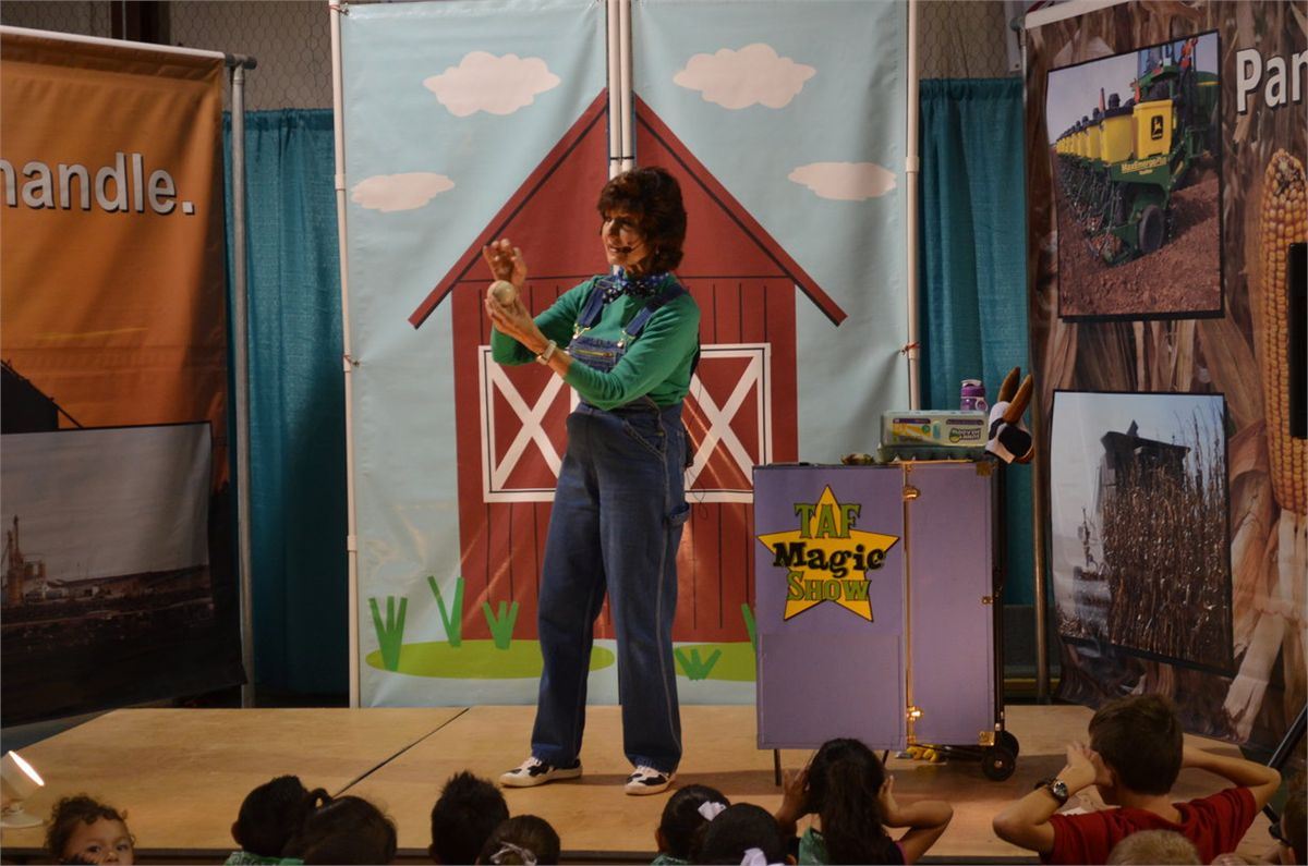 green shirt, overalls, red barn, black haired lady, kids, magic