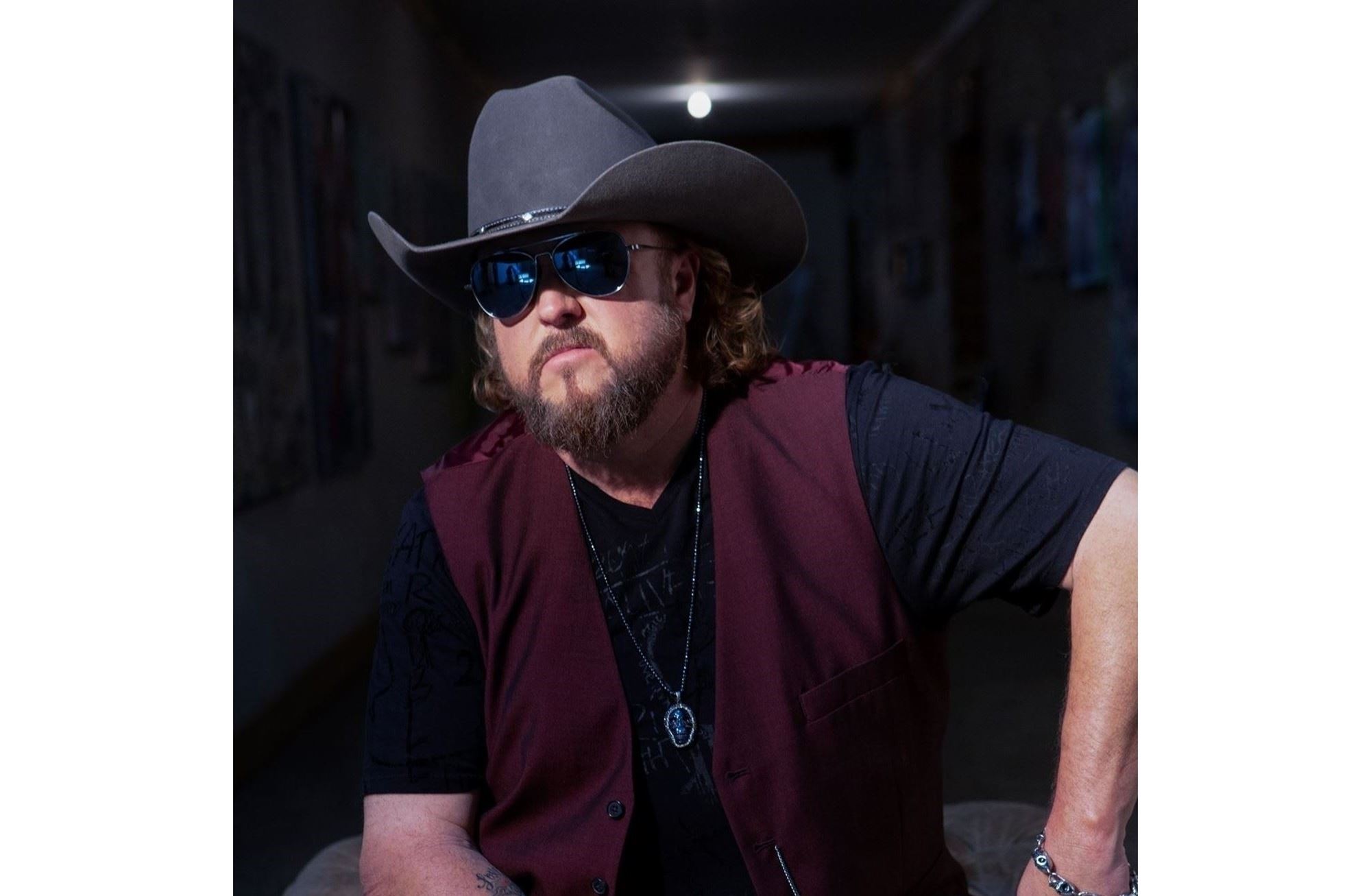 Photo: Colt Ford wearing cowboy hat and sunglasses