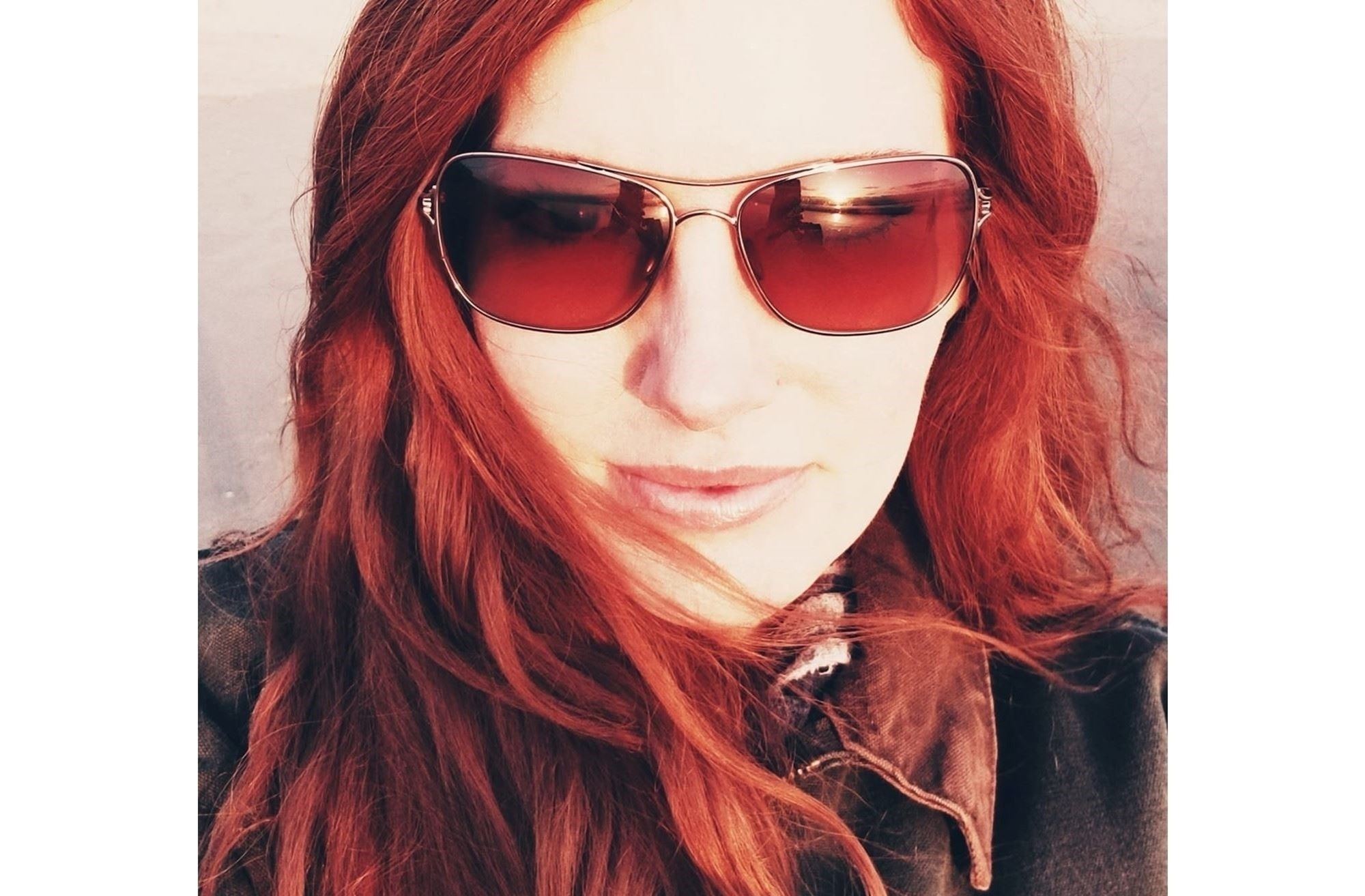 Photo: Catherine Loyer headshot wearing sunglasses