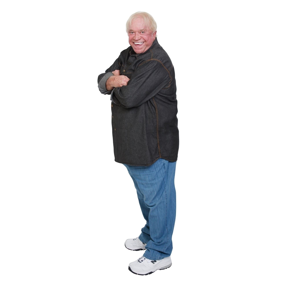 James Gregory standing with arms crossed smiling