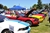This is a photo of multiple Ford Mustang autos lined up on display at the cars show.