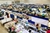 This is a shot of the show floor of the Expo Hall At Gem Faire from the ceiling area perspective, offering a view of the  many booths and gems and jewels for sale at the event.
