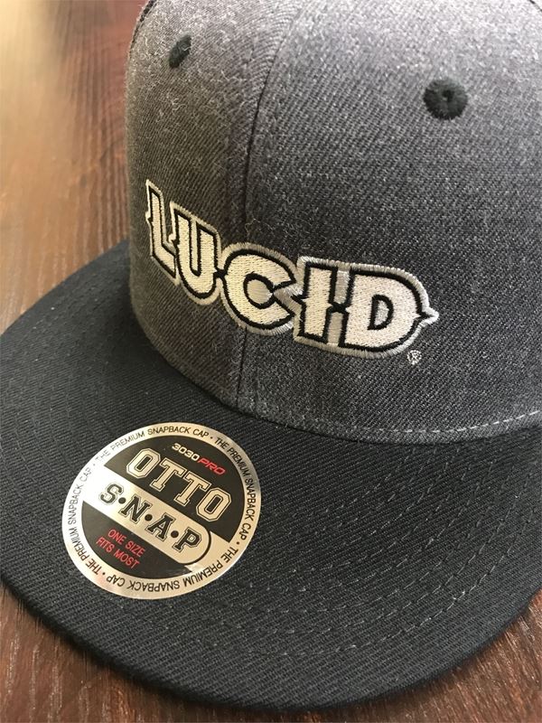 Custom grey hat with a black bill, LUCID is embroidered on to the front by Infinity Impressions in Portland, Oregon