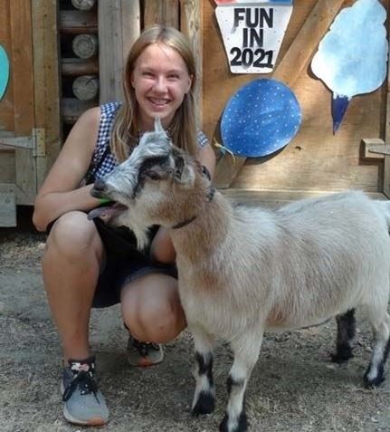 Girl with her Goat - photo from Heather Wroe (2021)