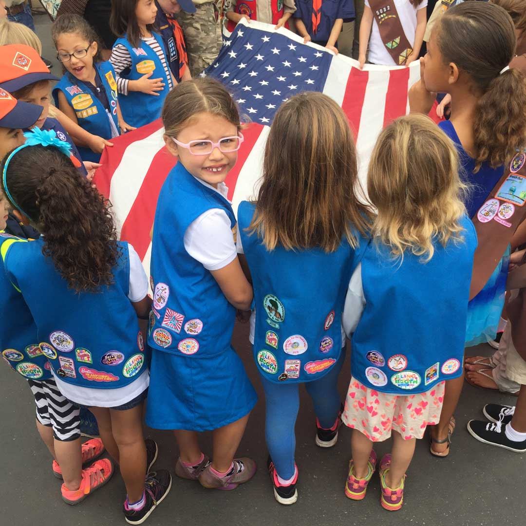 Girl Scouts raising U.S. flag
