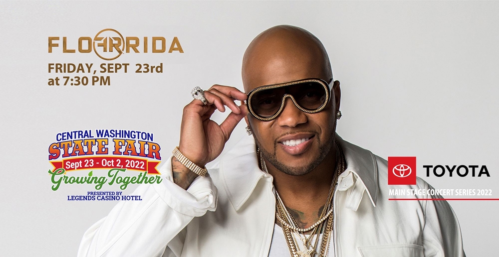 Publicity shot of Flo Rida pointing at the camera.