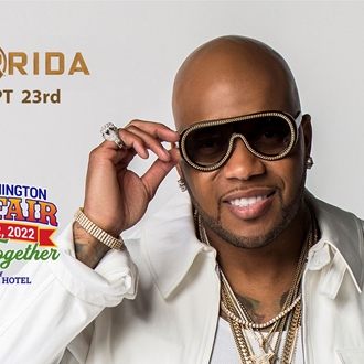 Publicity shot of Flo Rida pointing at the camera.