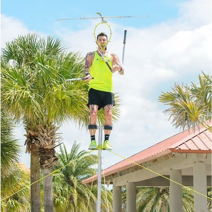 street performer juggling on stilts