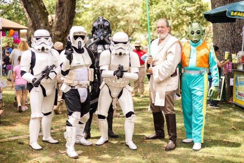 group of people dressed as Star Wars characters.