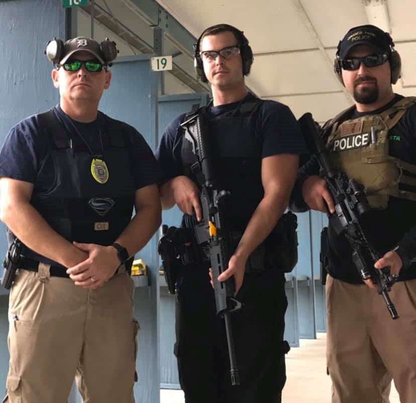 3 officers with protective gear at the gun range