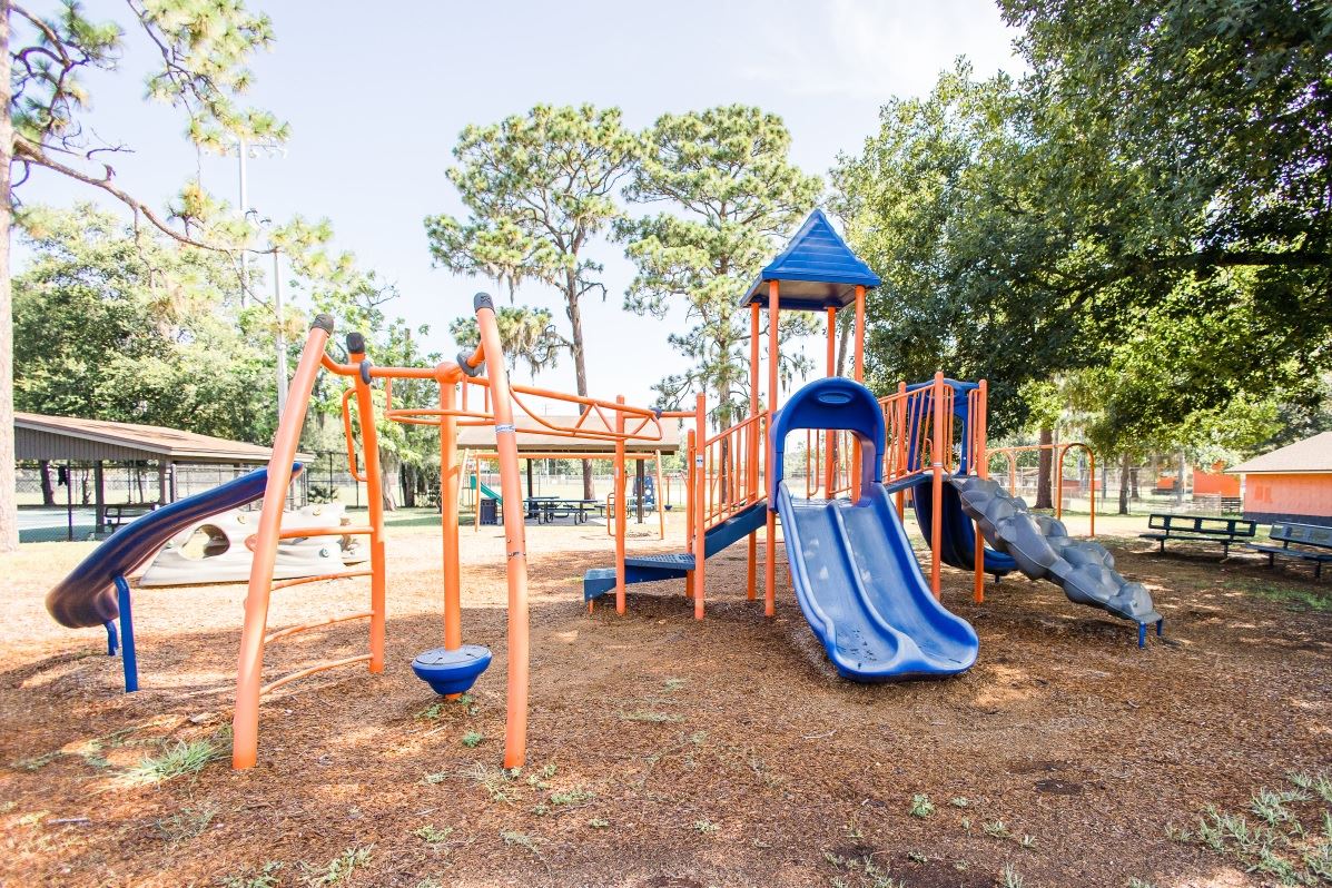 Playground structure with red mulch 