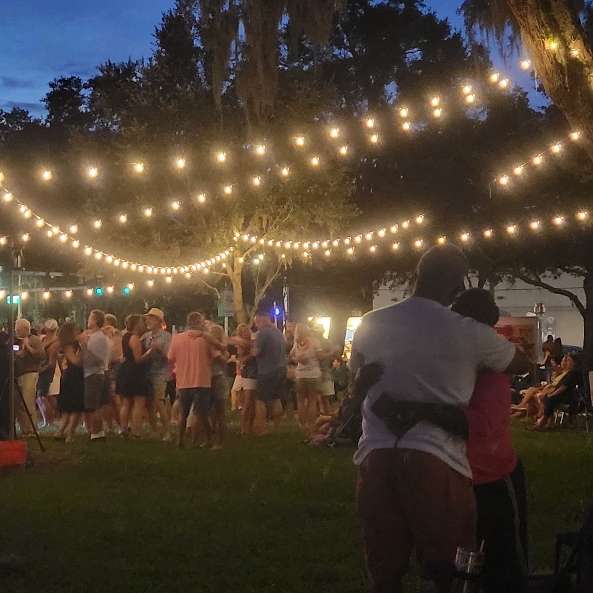 events with patio string lights and people dancing.