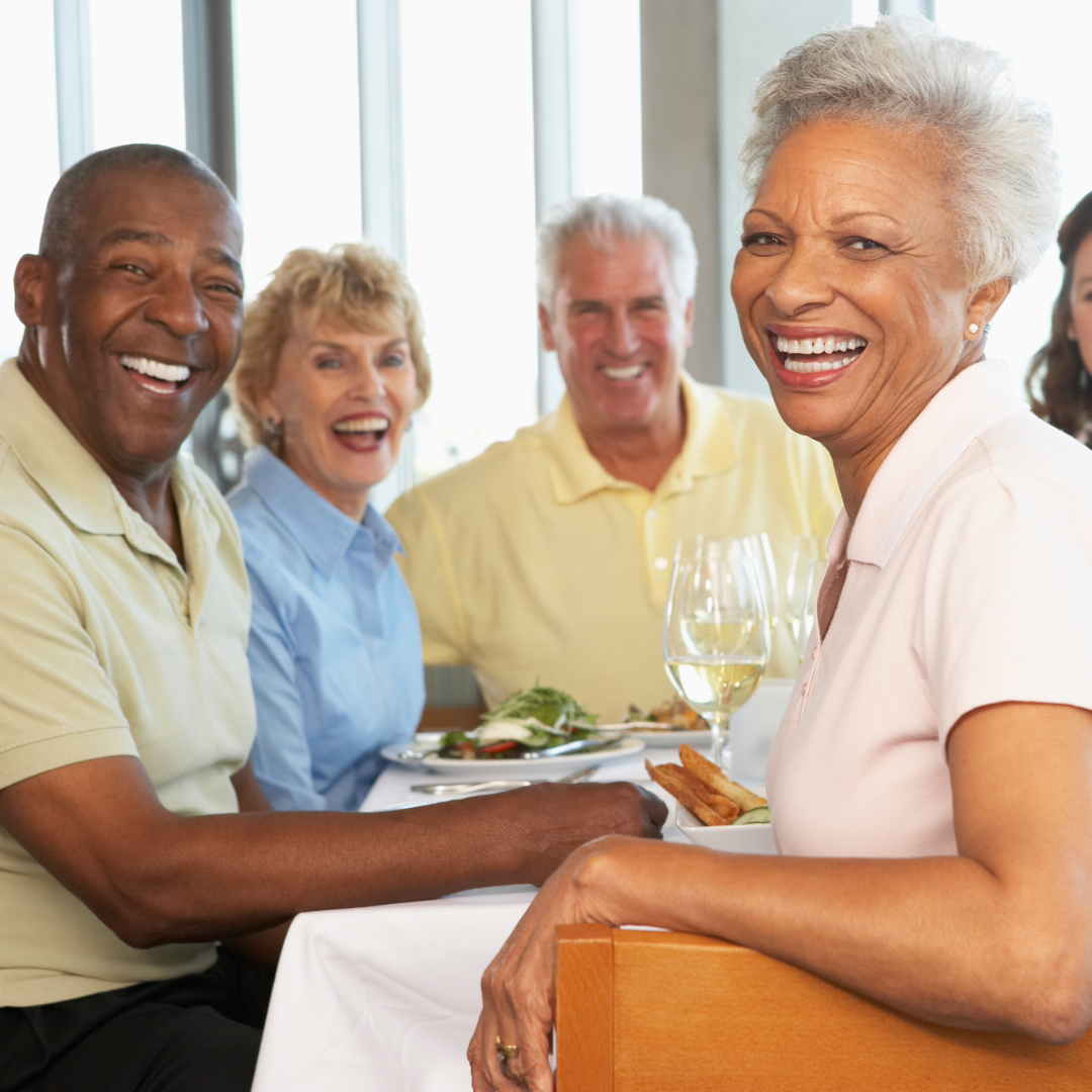 Group of 4 smiling senior citizens