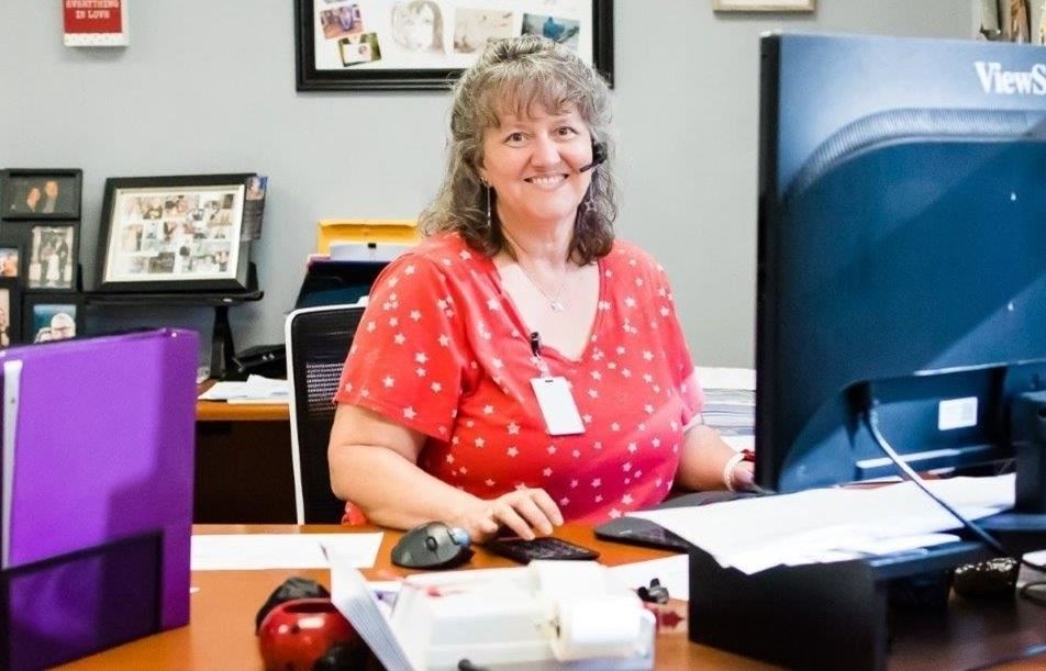 Smiling woman at her desk